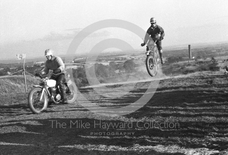 Soaring over the landscape, motorcycle scramble at Spout Farm, Malinslee, Telford, Shropshire between 1962-1965