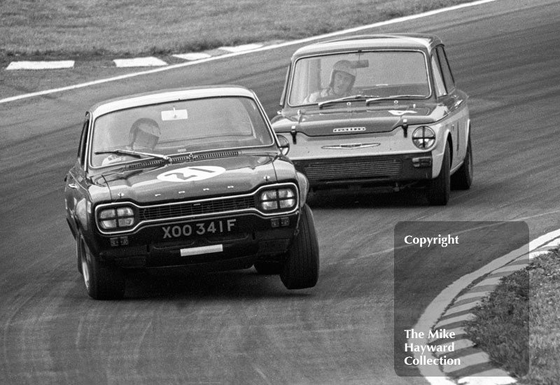 Chris Craft, Broadspeed Ford Escort (XOO&nbsp;34F), leads through South Bank Bend followed by Peter Harper, Hillman Imp, Brands Hatch, Grand Prix meeting 1968.
