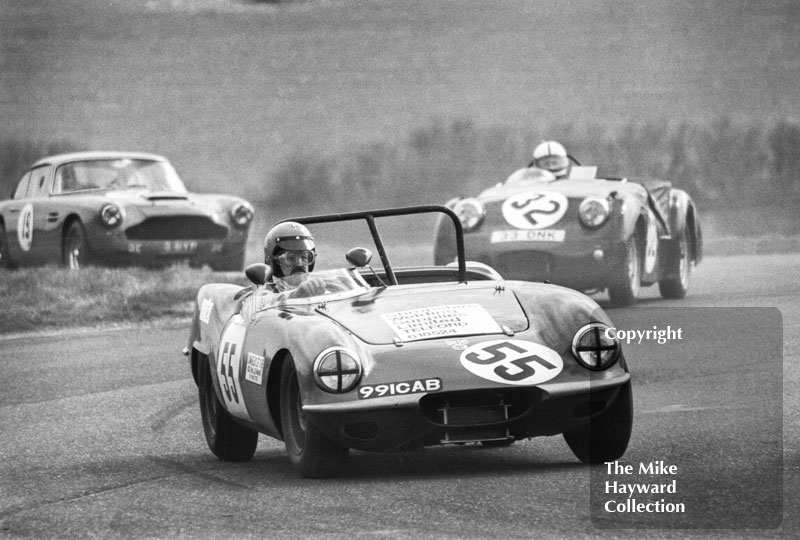 Ken Heywood, Elva Courier Mk 1 (991 CAB), followed by Andrew Ledingham, Triumph TR3A (33 DNK) and Geoff Reade, Aston Martin DB4,&nbsp;Philips Car Radio Thoroughbred Sports Car race, F2 International meeting, Thruxton, 1977.
