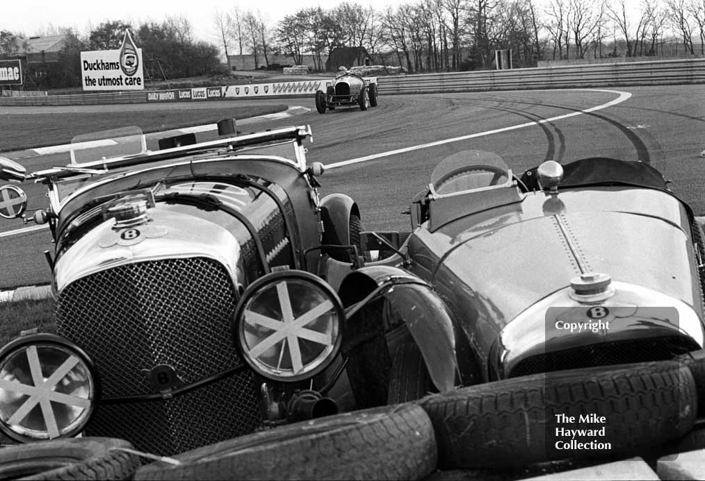 The 1928 Bentley of S Judd parked beside T C Llewellyn's 1929 Bentley&nbsp;at the chicane, VSCC Donington May 1979
