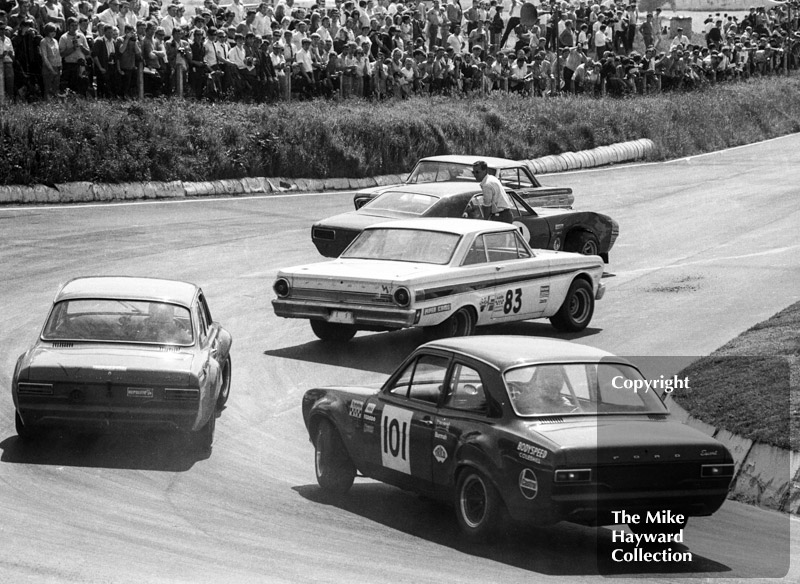 Dennis Leech's Ford Falcon Sprint spins and causes a traffic jam for Roy Pierpoint, Chevrolet Camaro, Terry Sanger, Ford Falcon Rallye Sprint, and Willy Kay, Ford Escort, British Saloon Car Championship race, BRSCC Guards 4,000 Guineas International meeting, Mallory Park, 1969.
