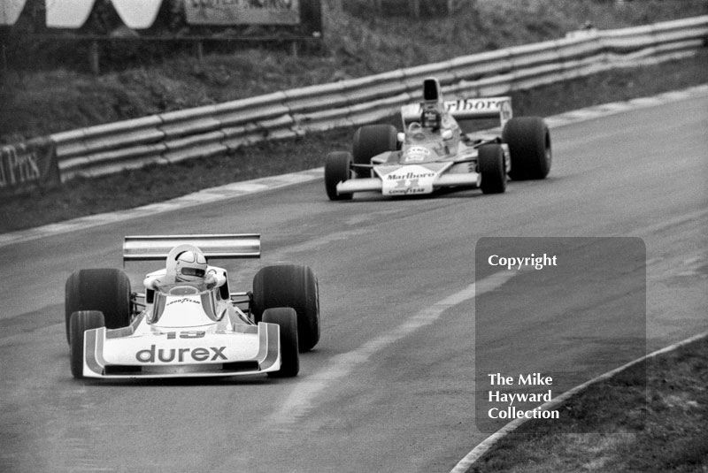 Alan Jones, Durex Surtees TS19, leads winner James Hunt, Marlboro McLaren M23, at Bottom Bend, Race of Champions, Brands Hatch, 1976.
