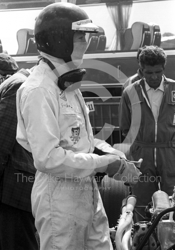 Jochen Rindt, Cooper Car Company Cooper Maserati, prepares for the start of the 1967 British Grand Prix at Silverstone.
