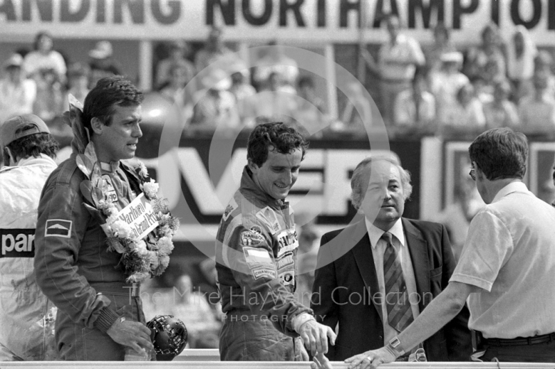 Alain Prost and Patrick Tambay on the podium, British Grand Prix, Silverstone, 1983.
