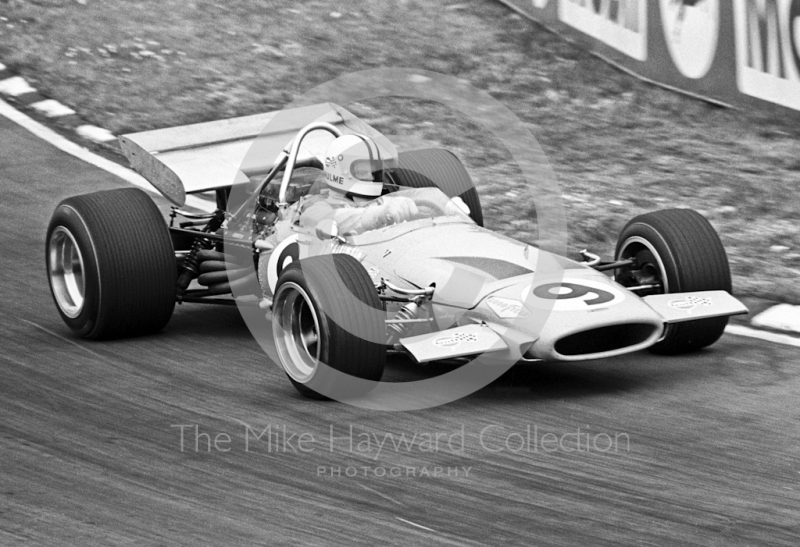 Third-placed Denny Hulme, McLaren M14D/1, at Bottom Bend, Brands Hatch, British Grand Prix, 1970.
