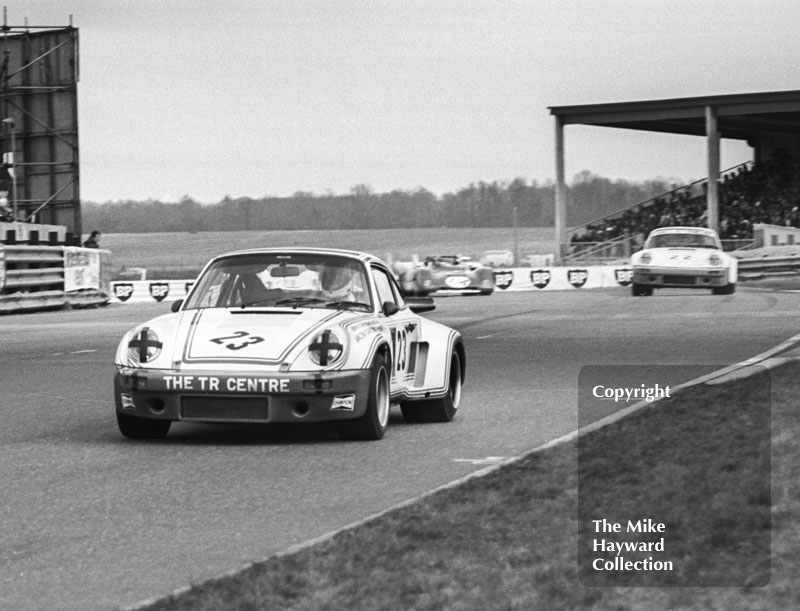 Mike Franey, Porsche Carrera, followed by Larry Perkins, Porsche 911, and Louis Lorenzini, Ferrari 312P, Philips Car Radio Ferrari/Porsche race, F2 International meeting, Thruxton, 1977.
