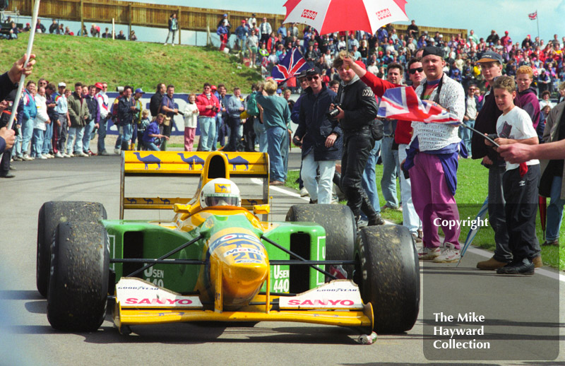 Martin Brundle, Benetton B192 Cosworth V8, negotiates the crowds after finishing 3rd, 1992 British Grand Prix, Silverstone.
