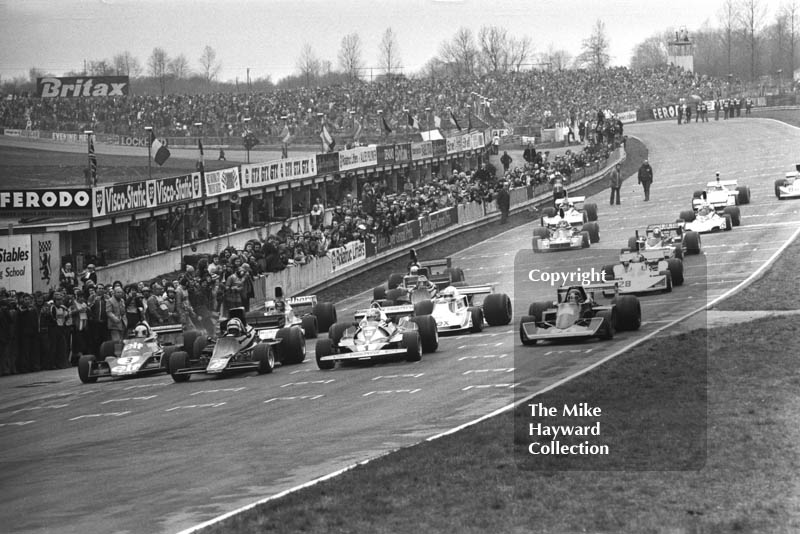 Jody Scheckter, Tyyrell 007, Gunnar Nilsson, JPS Lotus 77, Niki Lauda, Ferrari 312T/2, and Jacky Ickx, Wolf Williams FW05, leave the grid at the Race of Champions, Brands Hatch, 1976.
