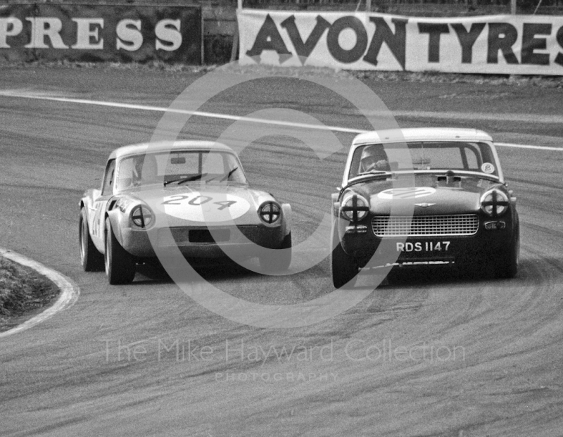 Richard Lloyd, Triumph Spitfire, alongside an&nbsp;MG Midget (RDS 1147), Lodge Corner, Sports Car Race, Oulton Park, 1969.

