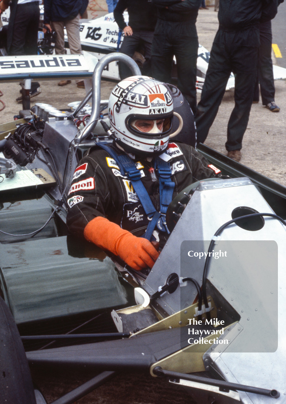 Alan Jones in his Williams FW07C in the pits at Silverstone, 1981 British Grand Prix.