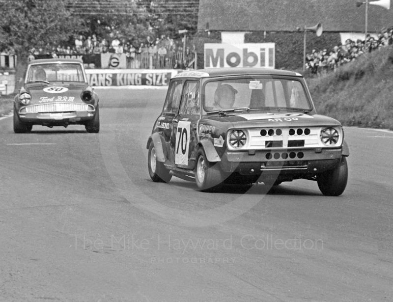 Jenny Dell, D J Bond Mini Clubman, followed by J Macdonald, Ford Anglia, Hepolite Glacier Saloon Race, Mallory Park, 1971
