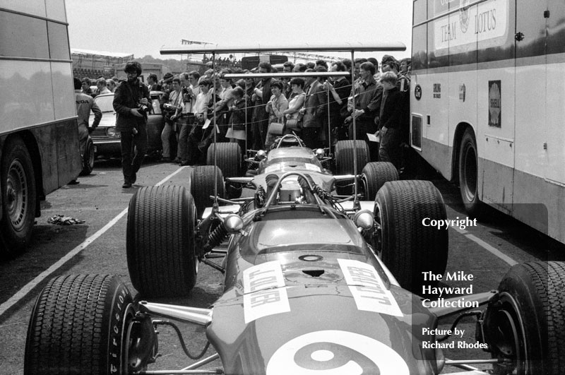 Jackie Oliver and Graham Hill's Lotus 49B's in the paddock at the 1968 British Grand Prix, Brands Hatch.<br />
<br />
<em>Picture by Richard Rhodes</em>
