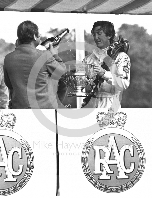 Jochen Rindt receives the winner's trophy with a cheque for ÃÂ£1,930. 10s, British Grand Prix, Brands Hatch, 1970
