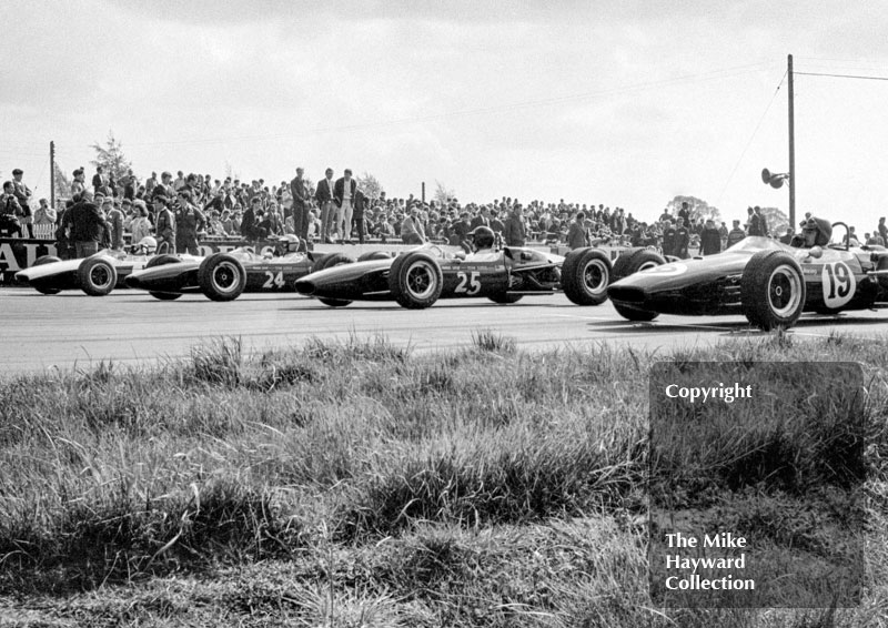 Seen from right are John Fenning, Brabham BT18, Roy Pike, Lotus 41, Piers Courage, Lotus 41, and Chris Irwin,&nbsp;Brabham BT18, Silverstone International Trophy, 1966.
