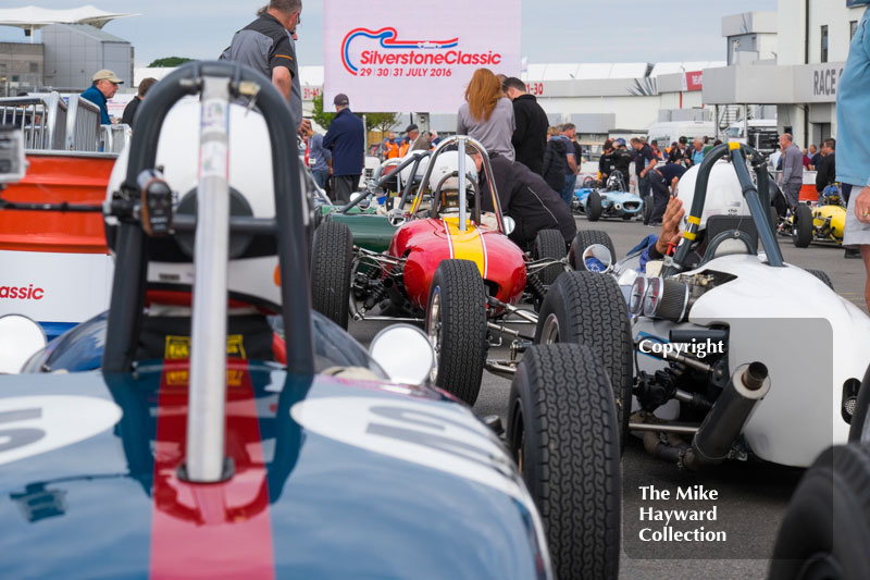 Formula Junior cars lined up in the paddock for the 2016 Silverstone Classic.
