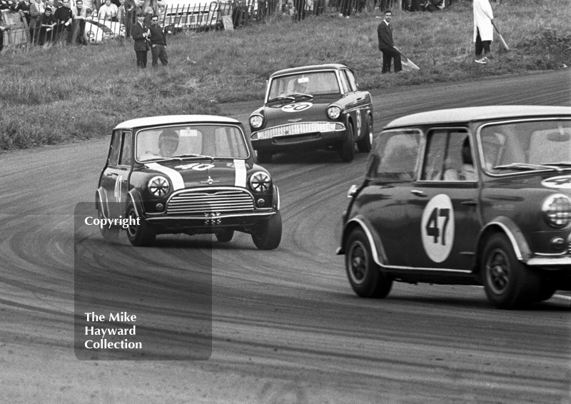 John Rhodes, Cooper Car Company Mini Cooper S, chasing Steve Neal, Mini Cooper S, through Cascades followed by Chris Craft, Superspeed Ford Anglia, Oulton Park Gold Cup meeting, 1967.
