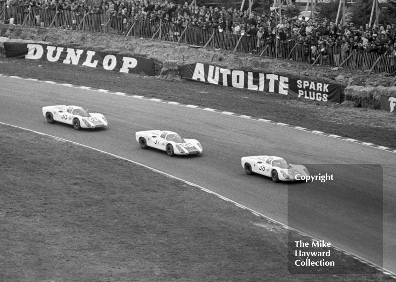 The Porsche team at Paddock Hill bend on the first lap at the BOAC 500, Brands hatch,&nbsp;1968. From the front, the cars and drivers are as follows.<br />
<br />
38 - Gerhard Mitter/LudovicoScarfiotti, Porsche 907<br />
37 - Jo Siffert/Hans Herrmann, Porsche 907<br />
36 - Vic Elford/Jochen Neerpasch, Porsche 907
