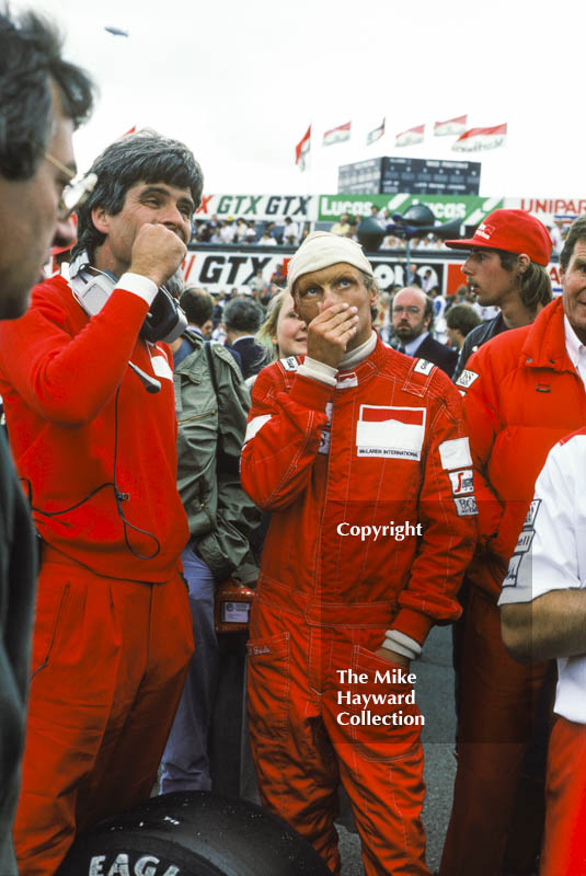 Niki Lauda, Marlboro McLaren MP4, ponders the weather on the grid, British Grand Prix, Silverstone, 1983
