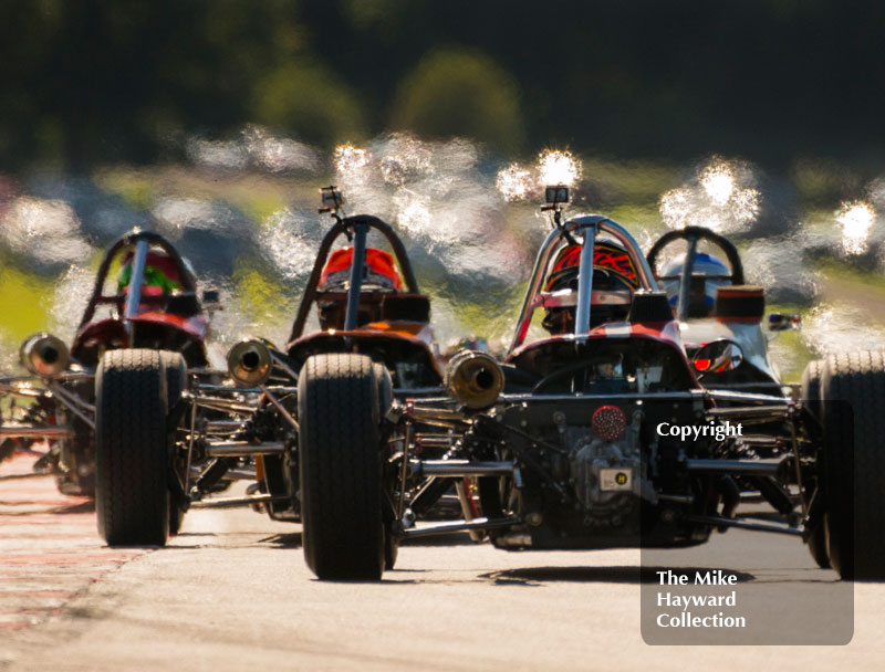 Formula Fords exiting Old Hall corner at the 2016 Gold Cup, Oulton Park.
