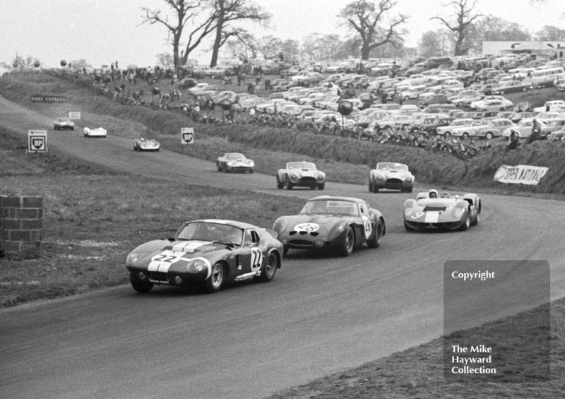 Jack Sears, Alan Mann Shelby Cobra, leads at the Tourist Trophy, Oulton Park, 1965. Following is Peter Sutcliffe, Ferrari, 250 and&nbsp;Bruce McLaren, Mclaren Elva Oldsmobile.
