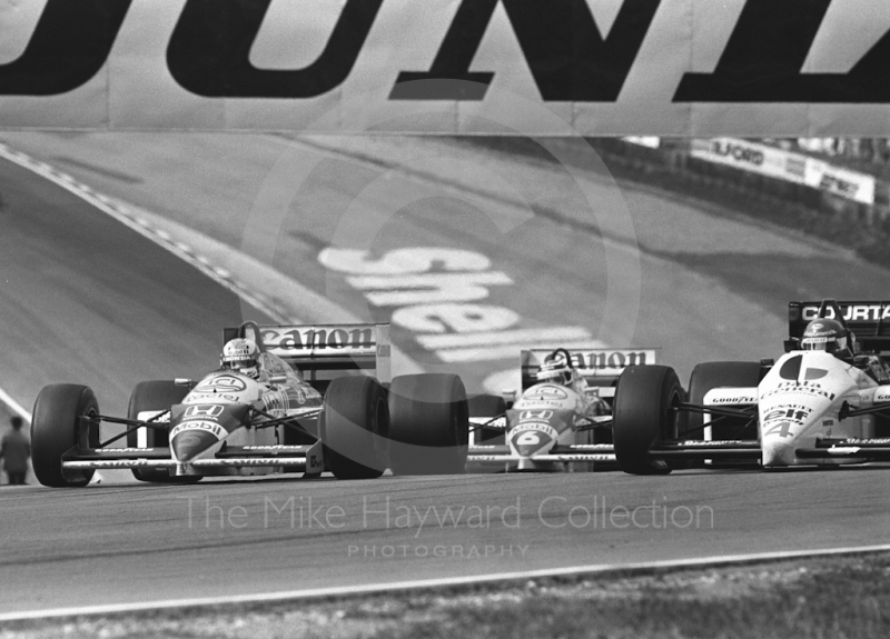 Nigel Mansell, Williams Honda; Nelson Piquet, Williams Honda; and Philippe Streiff, Tyrrell 015, Brands Hatch, British Grand Prix 1986.
