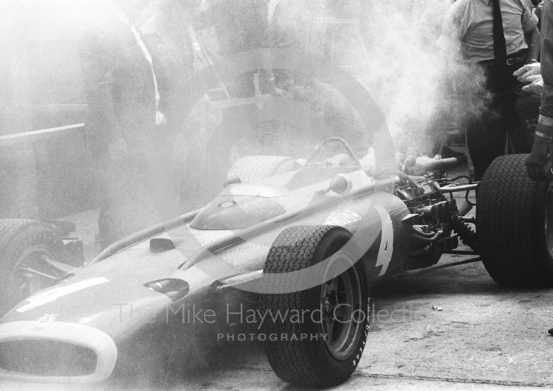 The H16 BRM of Mike Spence on fire in the pits, Silverstone, 1967 British Grand Prix.
