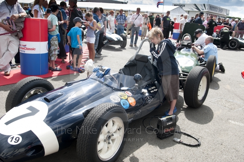 A young boy looks into the cockpit of Nick Wigley's 1959 Cooper T51, Pre-1966 Grand Prix Cars, Silverstone Classic 2010