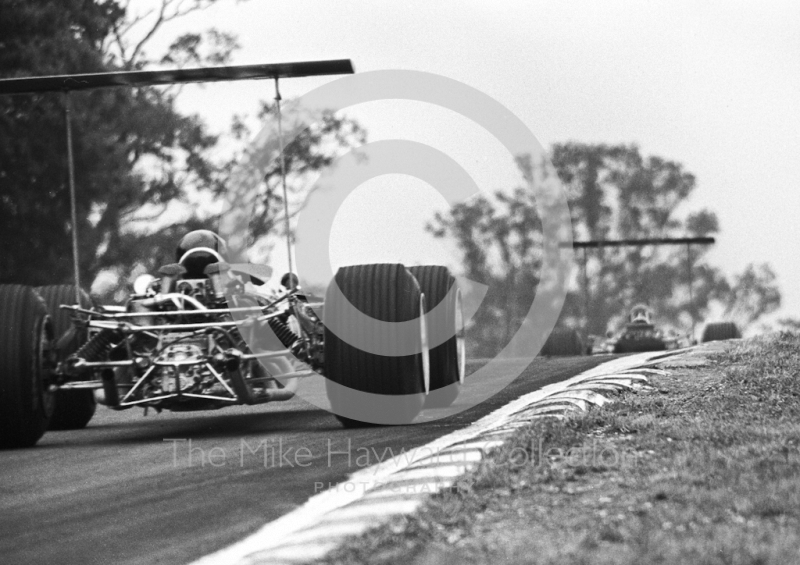 Graham Hill, Lotus Cosworth V8 49B R5, leads team mate Jackie Oliver out of South Bank Bend, British Grand Prix, Brands Hatch, 1968.