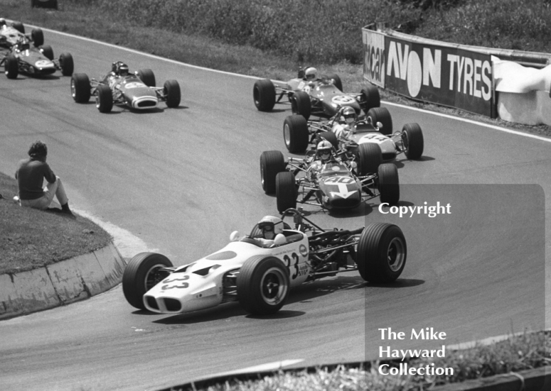 Winner Tetsu Ikuzawa, Mike Spencer Lotus 59, leads Peter Gaydon, SMR Tecno 69 and Tim Schenken (23), Brabham BT28,&nbsp;at Shaw's Hairpin, Guards Formula 3 Trophy, Mallory Park, June 1969.
