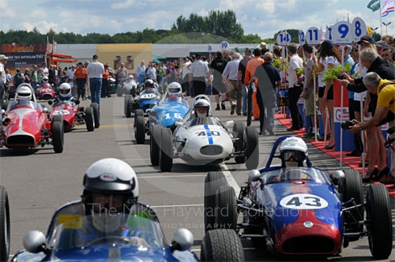 Doug Martin, 1960 Elva 200, followed by Dietrich Merkel, 1960 Britannia, and Gordon Wright, 1959 Stanguellini, in the paddock queue ahead of the Colin Chapman Trophy Race for Historic Formula Juniors, Silverstone Classic 2009.