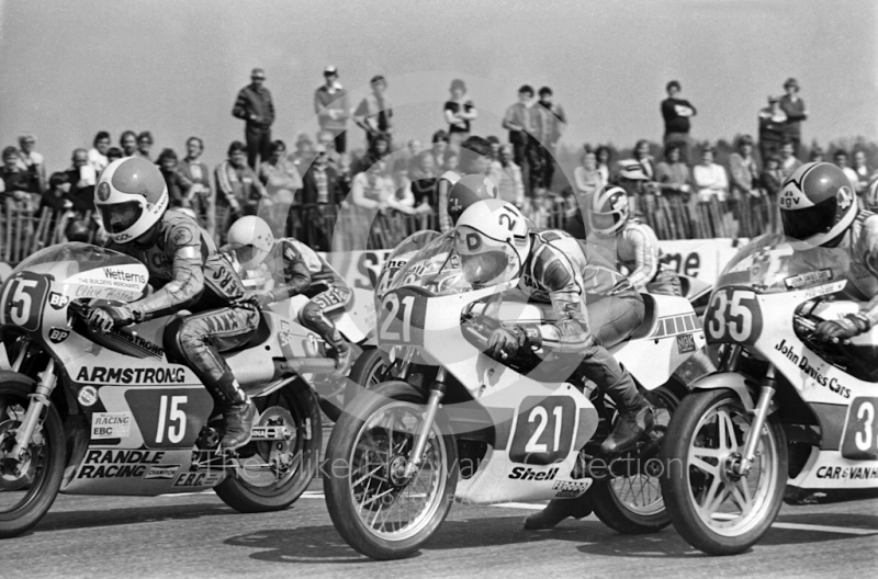   Clive Horton, 250cc Armstrong, and Tom Drury, 250cc Yamaha, leave the grid at the John Player International Meeting, Donington Park, 1982.