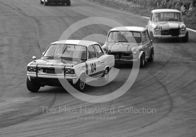 Gerry Marshall, Vauxhall Viva GT, followed by Brian Chatfield, Mini, and Bob Fox, Mini, Lodge Corner, Oulton Park, 1969
