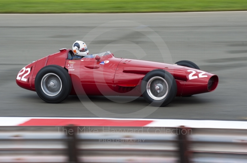 1958 Maserati 250F of Allan Miles at Woodcote Corner during the HGPCA event for front engine GP cars at 2010 Silverstone Classic