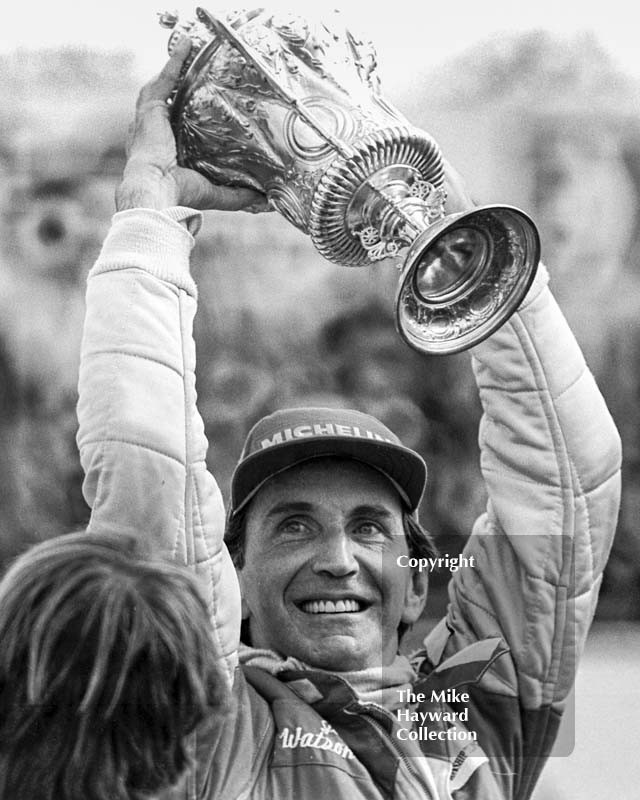 John Watson lifts the winner's trophy, Silverstone, British Grand Prix 1981.
