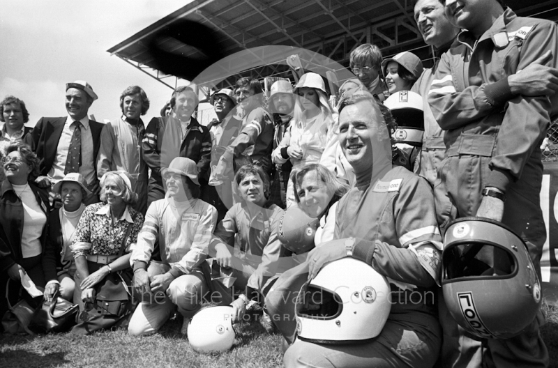 Celebrities line up for a photocall before the start of their Escort race at the 1974 British Grand Prix meeting at Brands Hatch.
