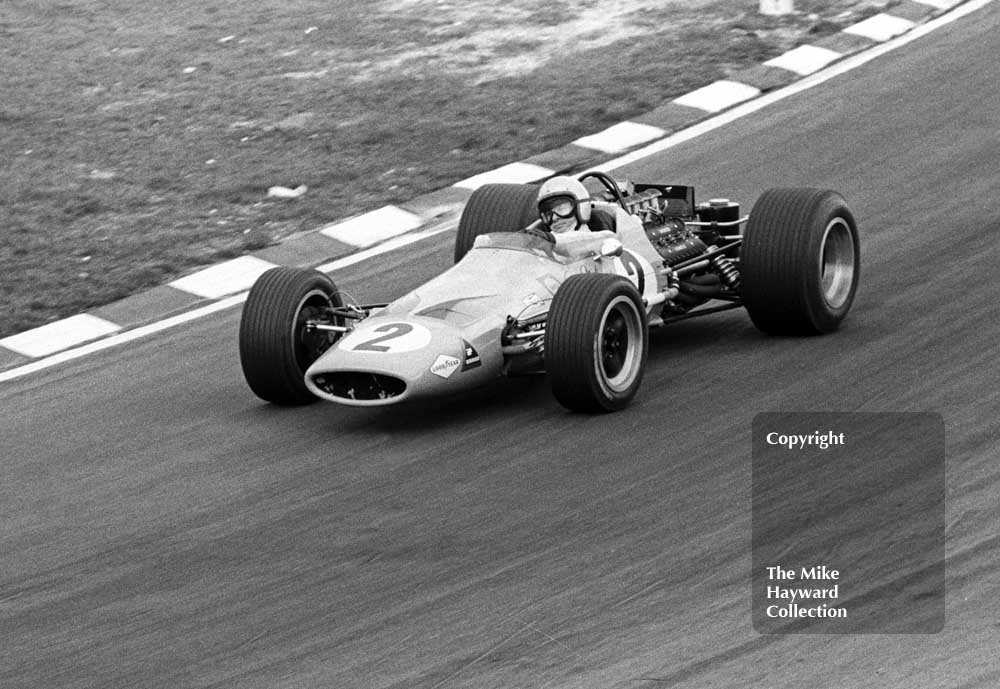 Winner Bruce McLaren, McLaren M7A/1 V8, on the way to collecting Â£500 for 1st place! Race of Champions, Brands Hatch, 1968