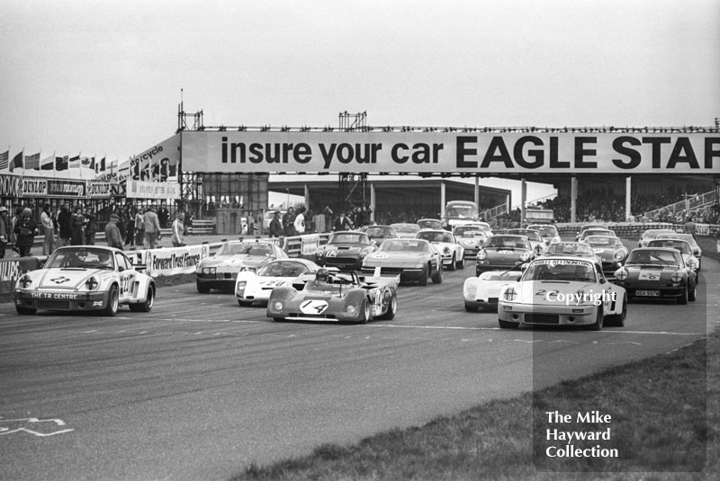 Starting grid - Mike Franey, Porsche Carrera, Louis Lorenzini, Ferrari 312P, and Larry Perkins, Porsche 911, Philips Car Radio Ferrari/Porsche race, F2 International meeting, Thruxton, 1977.
