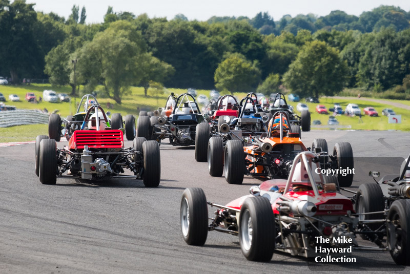 Formula Fords swarm out of Old Hall at the 2017 Gold Cup, Oulton Park.

