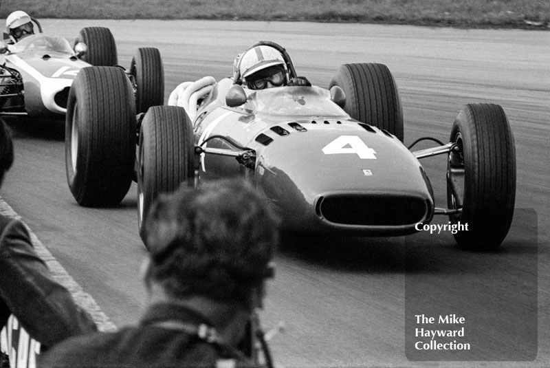 John Surtees, Ferrari 312, followed by John Taylor, Brabham BT11, 1966 International Trophy, Silverstone.

