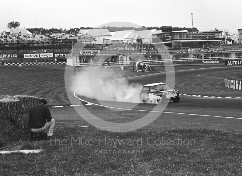 John Rhodes, Cooper Car Company Mini Cooper S, smoking through South Bank Bend during practice, Brands Hatch, Grand Prix meeting 1968.
