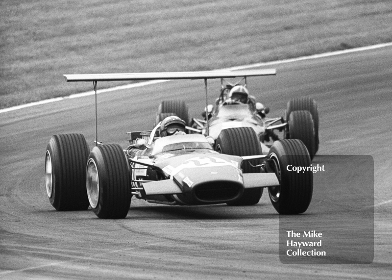 Jo Siffert, Rob Walker Lotus Cosworth V8 49B R7, leads Chris Amon, Ferrari V12 312 0011, through South Bank Bend, British Grand Prix, Brands Hatch, 1968.