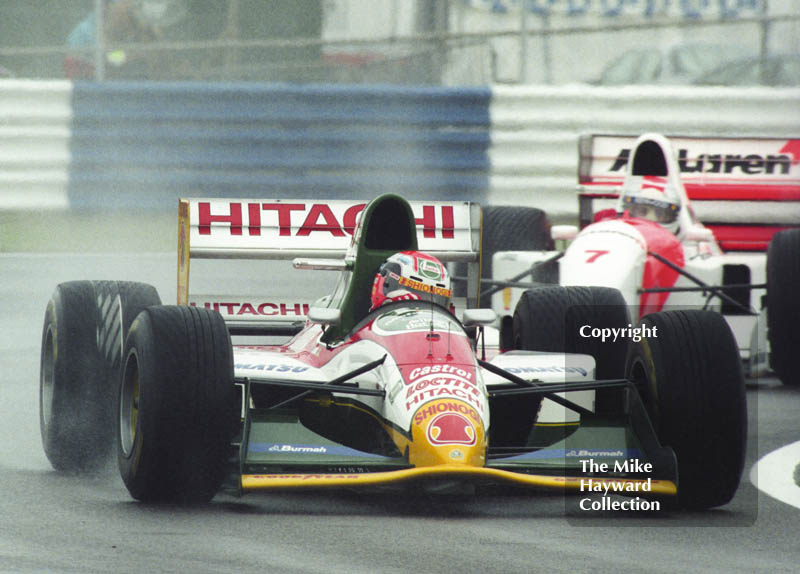 Johnny Herbert, Lotus 107B, Michael&nbsp;Andretti, McLaren MP4/8, seen during wet qualifying at Silverstone for the 1993 British Grand Prix.
