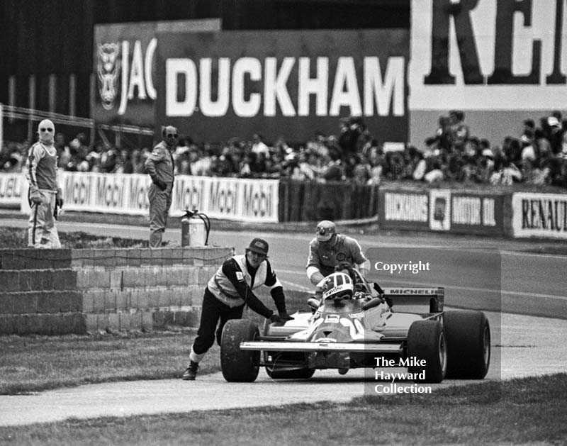 Didier Pironi gets a push back to the pits during qualifying in his Ferrari 126CK, Silverstone, British Grand Prix 1981.
