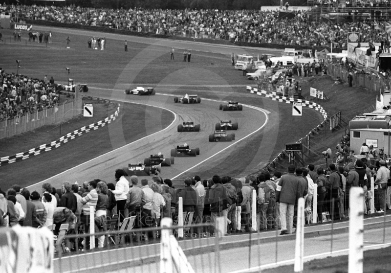 The field makes its way through South Bank Bend, 1985 European Grand Prix, Brands Hatch
