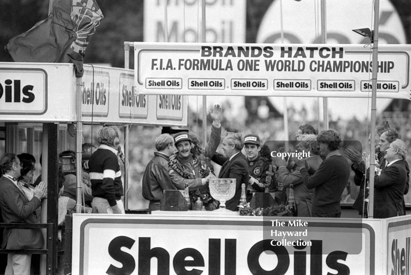 Nigel Mansell and Ayrton Senna celebrate on the podium, Brands Hatch, 1985 European Grand Prix.
