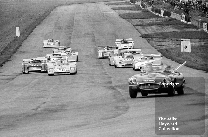 Jaguar E-type course car leads Willie Green, Ferrari 512M, and Leo Kinnunen, Porsche 917, 1972 Super Sports 200, Silverstone.
