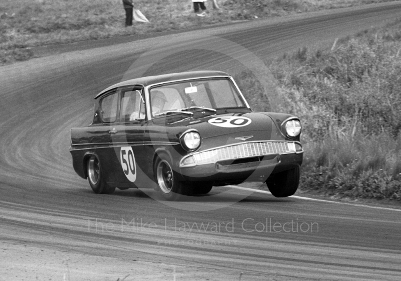 Chris Craft, Superspeed Conversions Ford Anglia, on three wheels before retiring on lap 17, Cascades Bend, Oulton Park Gold Cup meeting 1967.
