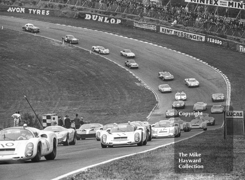 Jochen Rindt/Graham Hill, Porsche 910; Jo Siffert/Bruce McLaren, Porsche 910; and Vic Elford/Lucien Bianchi, Porsche 910, Brands Hatch, BOAC 500 1967.
