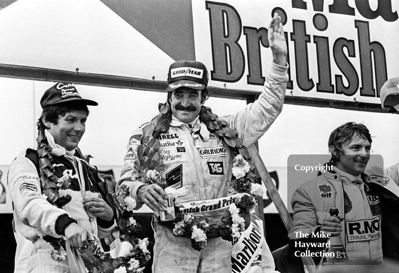 Winner Clay Regazzoni on the podium with Rene Arnoux and Jean-Pierre Jarier, Silverstone, British Grand Prix 1979.
