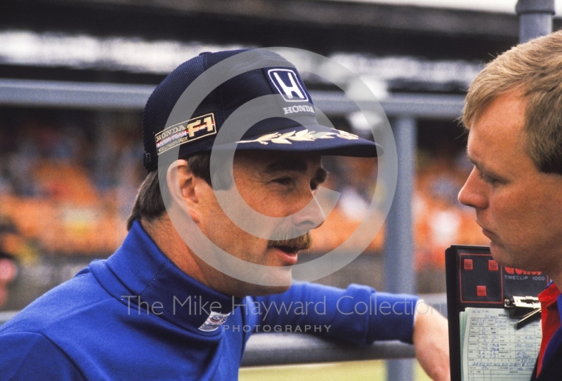 Nigel Mansell and a race engineer in the pits, Silverstone, 1987 British Grand Prix.
